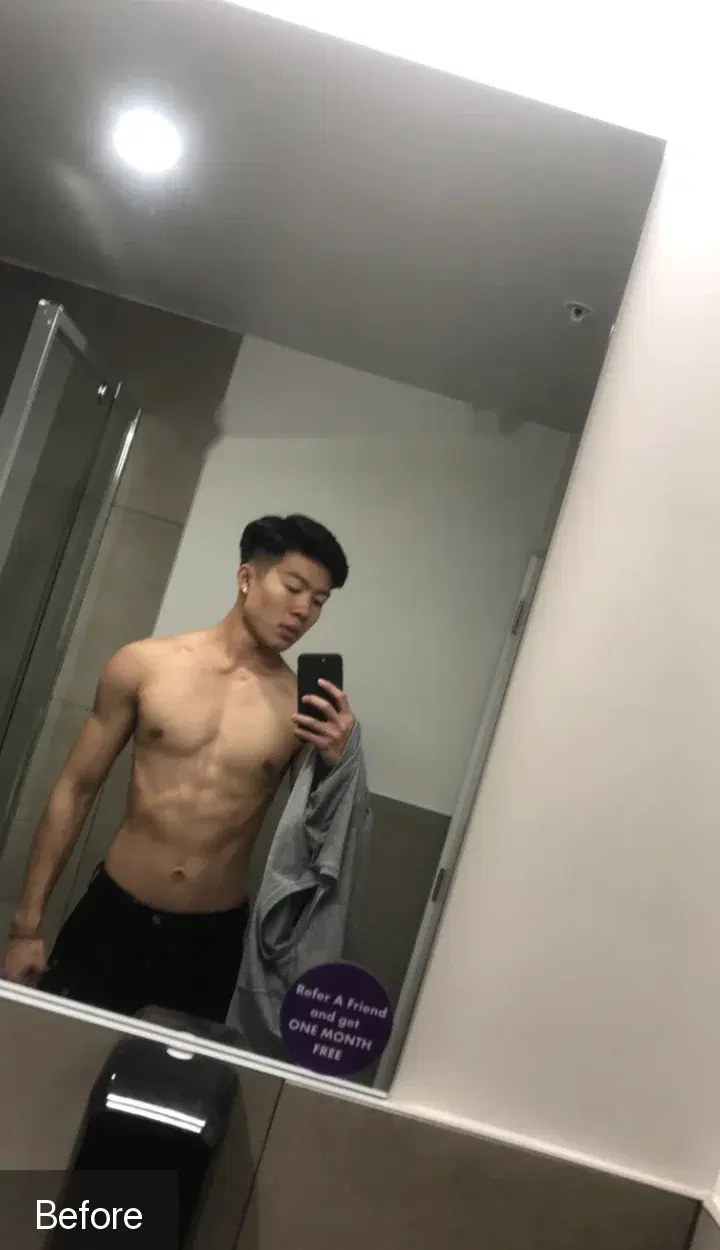 Before: a lean young man taking a mirror selfie at the gym